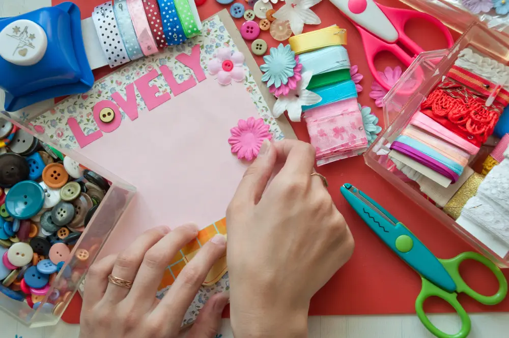 close up of a person making a valentine's day craft