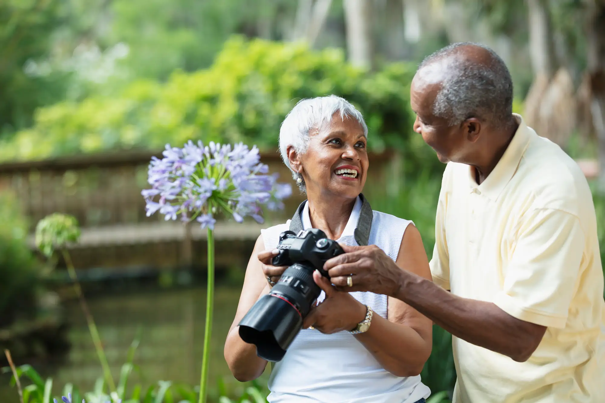 An elderly couple doing photography, one of the best clubs for seniors at Windsor at Celebration in Kissimmee, FL.
